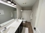 Discover the Private Oasis of the Lower Level Guest Bathroom  Ideal for Relaxing in a Steamy Retreat and Unwinding in Tranquility